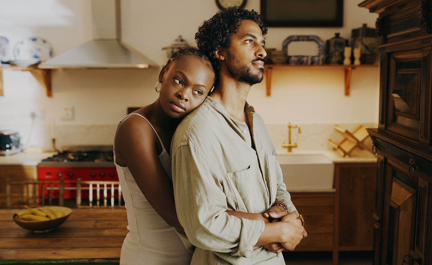 Couple embracing in a warm kitchen setting, showing emotional connection and intimacy – relationship counselling support by Freedom Couple Counselling.