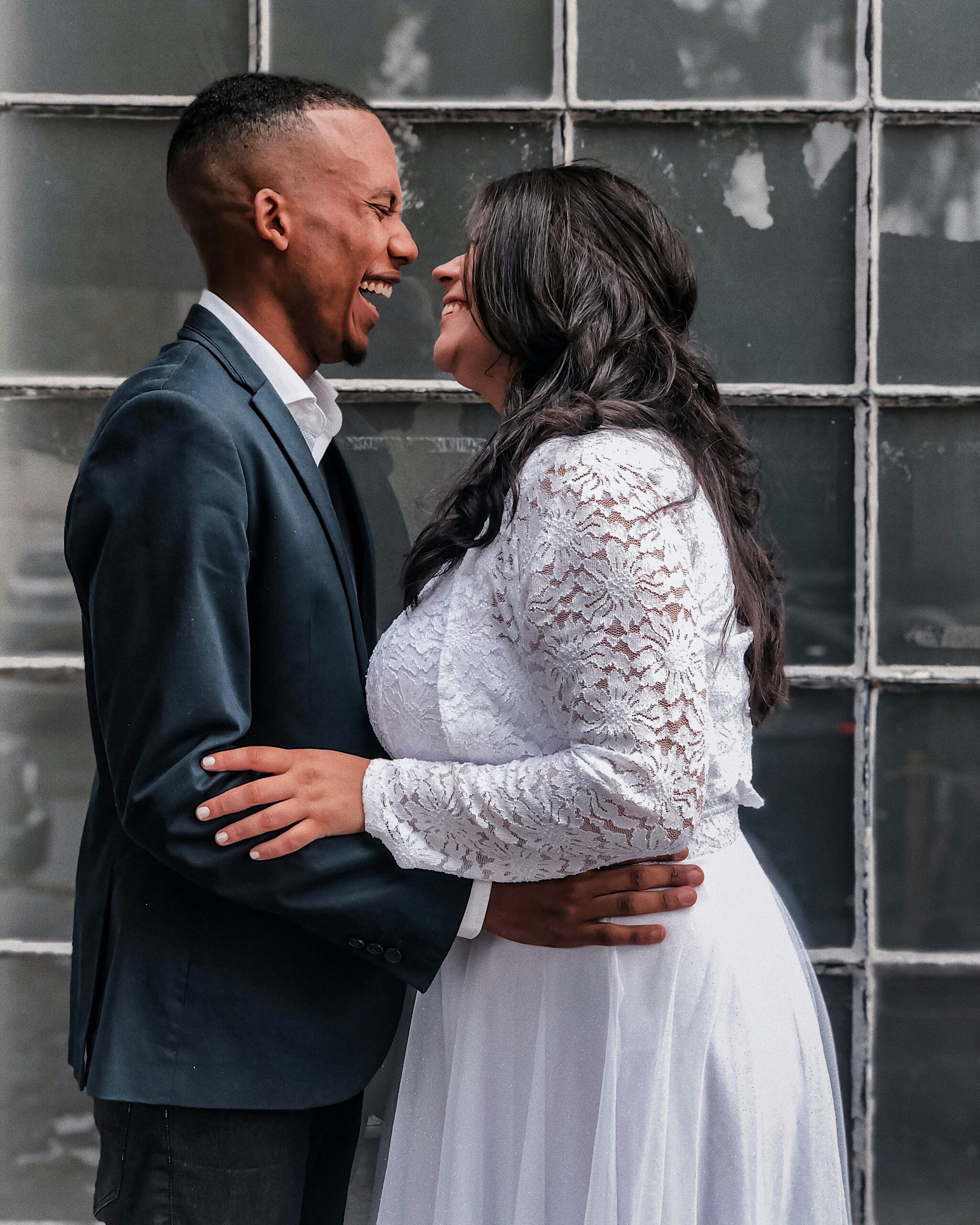 interracial couple sitting together looking thoughtful, representing interracial and intercultural couples counselling Melbourne