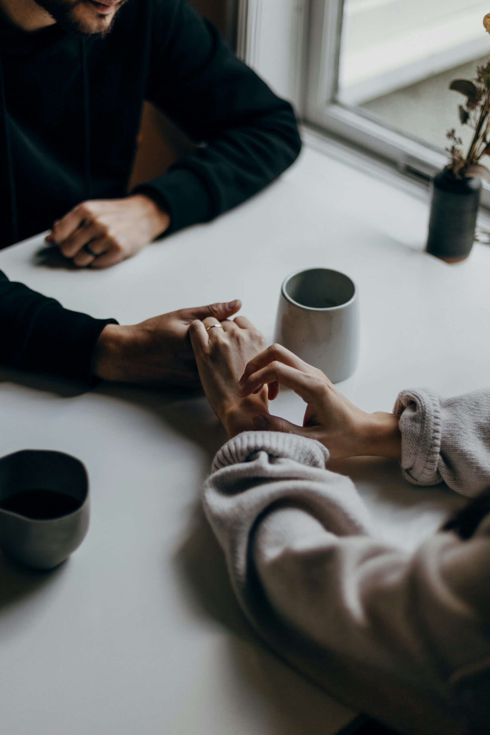 couple sitting together on a couch talking to a therapist in their first couples counselling session Melbourne